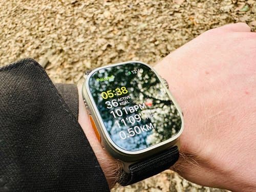 Apple Watch Ultra displaying workout metrics on a wrist outdoors